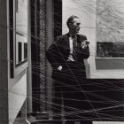 Marcel Duchamp [1942] Behind Mile of String. First Papers of Surrealism, New York. Photo by Arnold Newman.