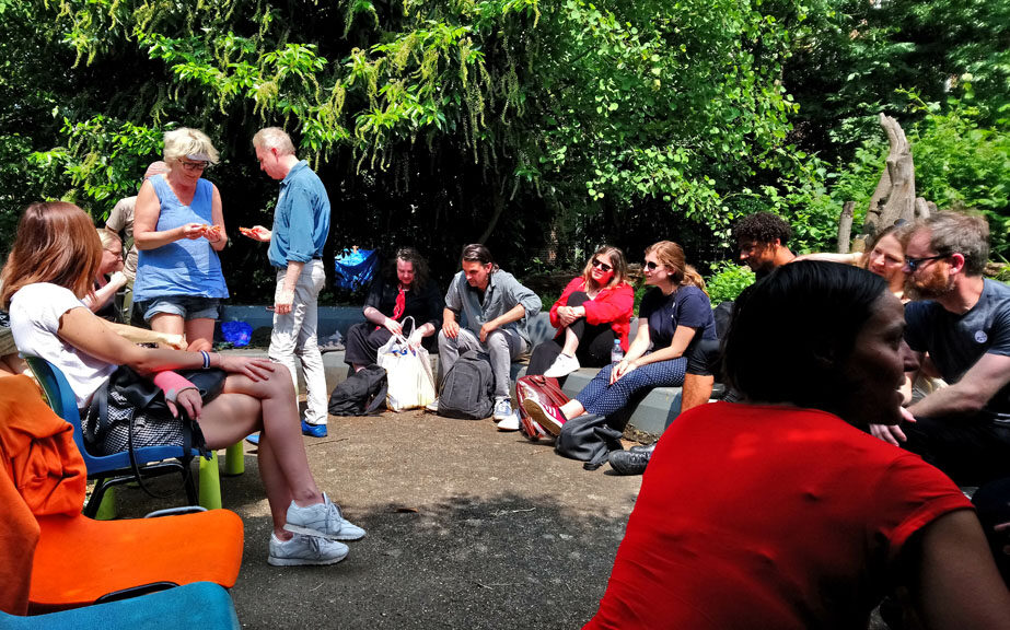 Group discussion on art and gentrification in the Old Tidemill Garden, Reginald Road. Photo by Ruth Gilburt.